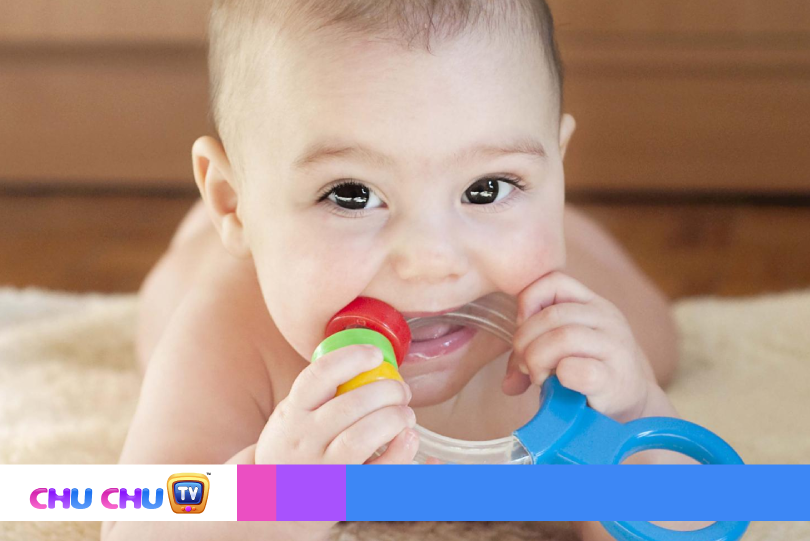 baby crying near a teething toy